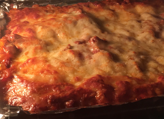 Cheesy Bolognese Lasagna baking in the oven