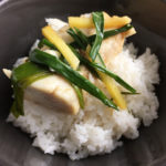 Fish with ginger and green onions on rice