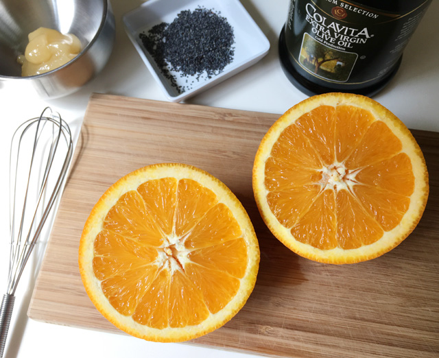 Orange Poppyseed Dressing ingredients of a fresh orange, honey, poppyseeds, and extra virgin olive oil