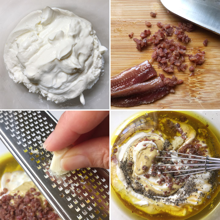A bowl of white yogurt, minced fish filets on a wood cutting board, a garlic clove being grated using a microplane, a bowl containing white yogurt, oil, pepper, mustard, and a whisk