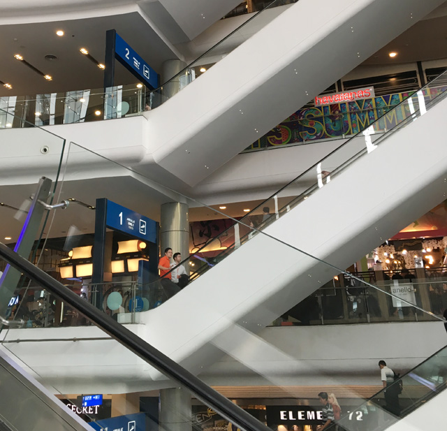 White escalators in a mall