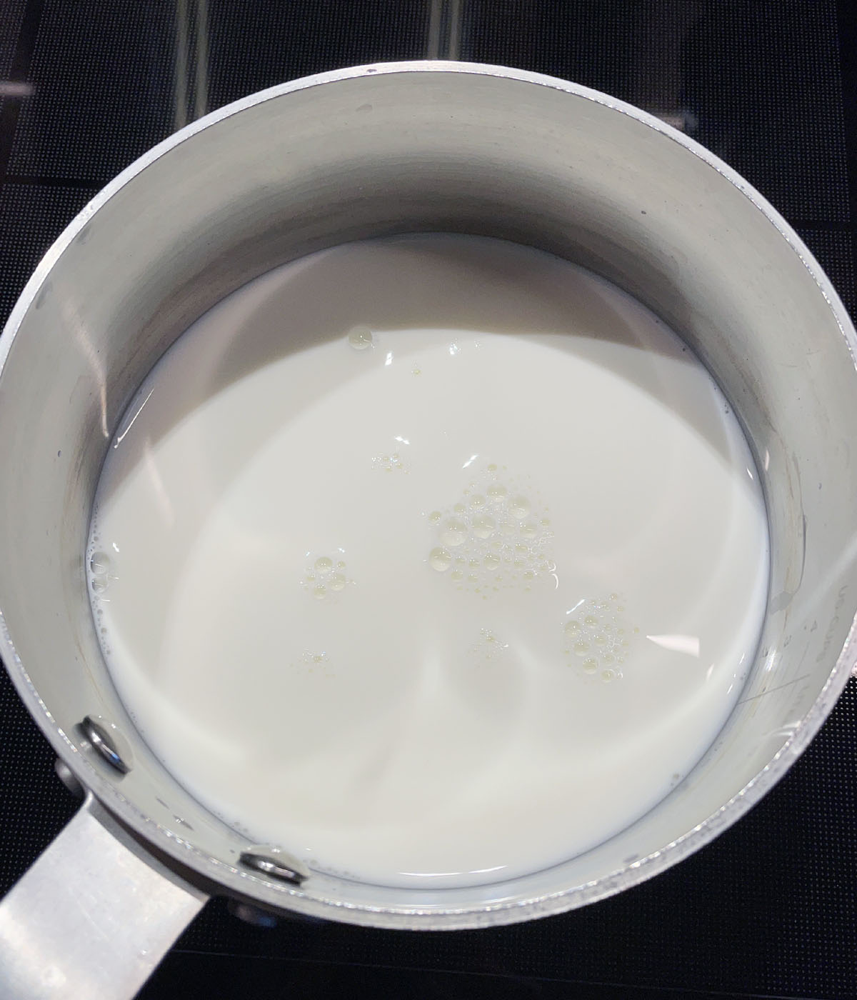 Milk in a metal pot.