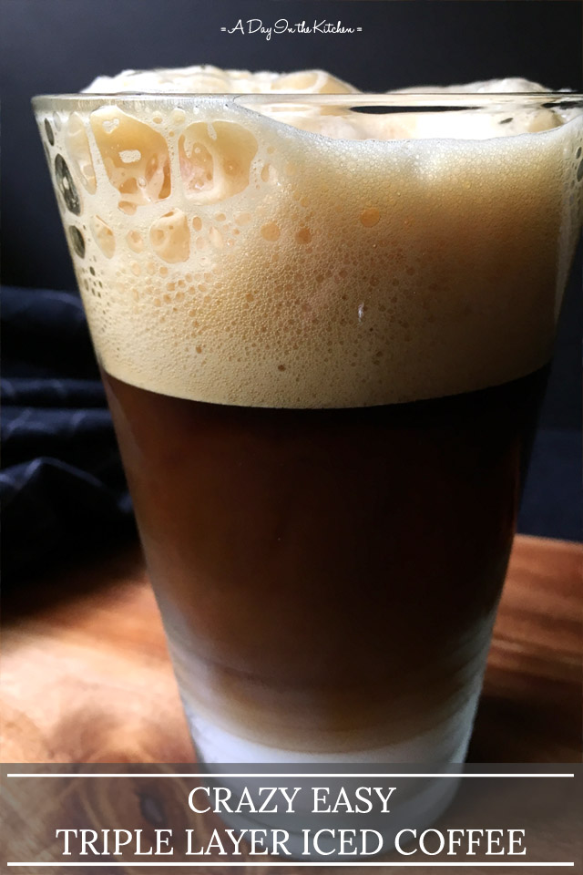 A glass containing while milk on the bottom, brown coffee in the middle, and light brown foam on top; the words crazy easy triple layer iced coffee on the bottom