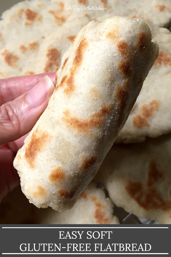 Close-up of a hand holding a rolled flatbread, with the words easy soft gluten-free flatbread on the bottom