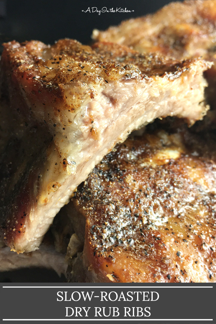 Close-up of a cut section of pork ribs, the words slow-roasted dry rub ribs on the bottom