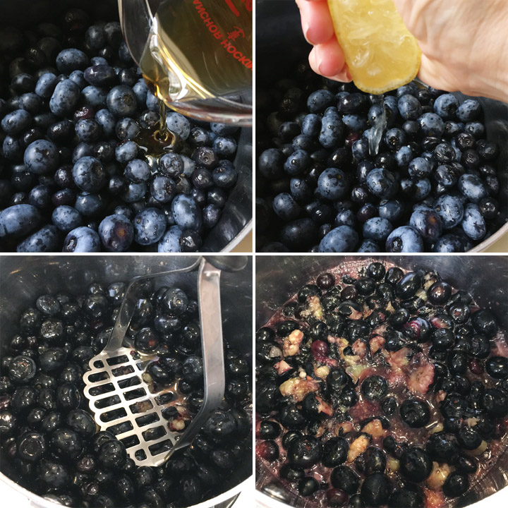 Cooking blueberries in a pot with brown maple syrup and lemon juice, a potato masher mashing the blueberries