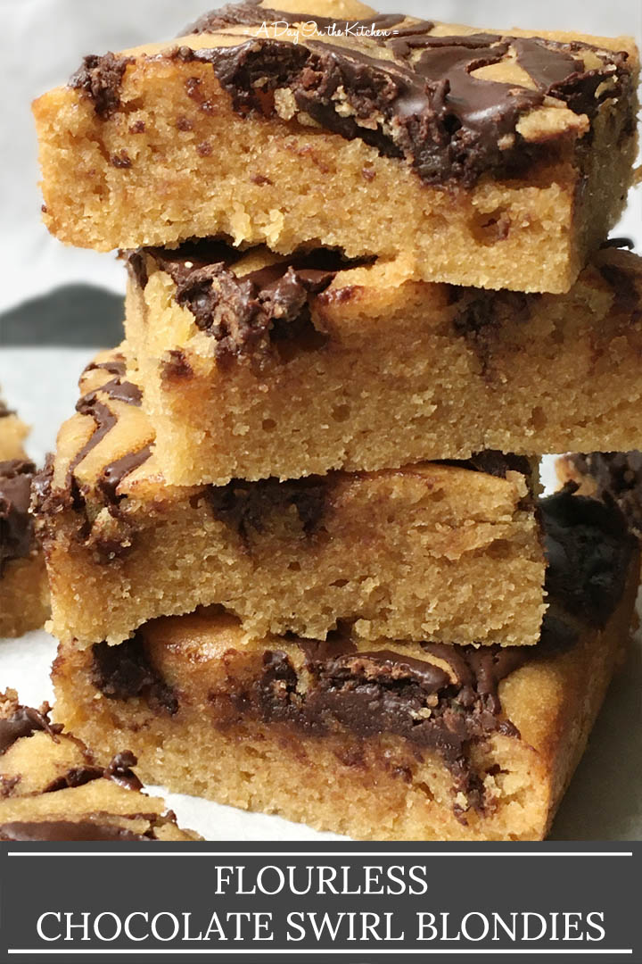 A stack of four baked squares, the words flourless chocolate swirl blondies on the bottom
