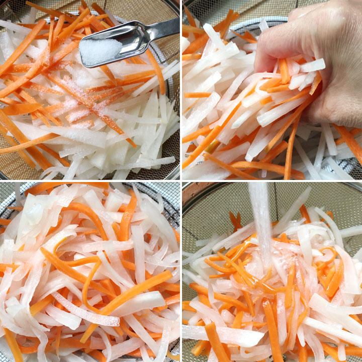 Matchstick shaped white radish and orange carrot in a colander with salt, being mixed with a hand, and rinsed under running water