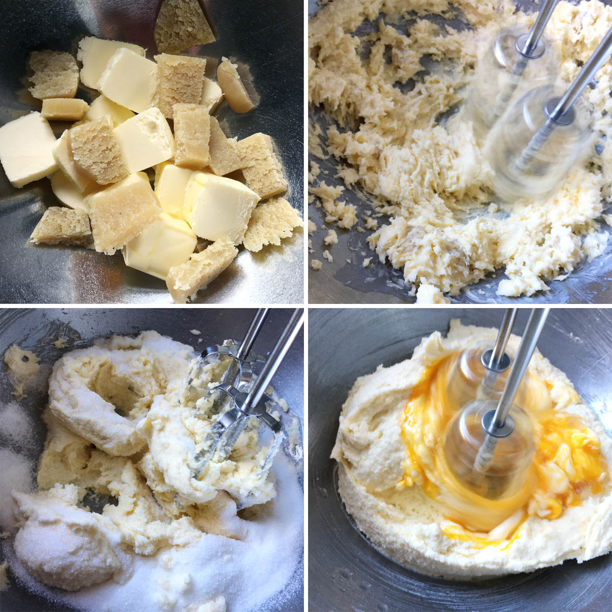 Metal mixer beaters mixing together butter with white sugar and yellow eggs.