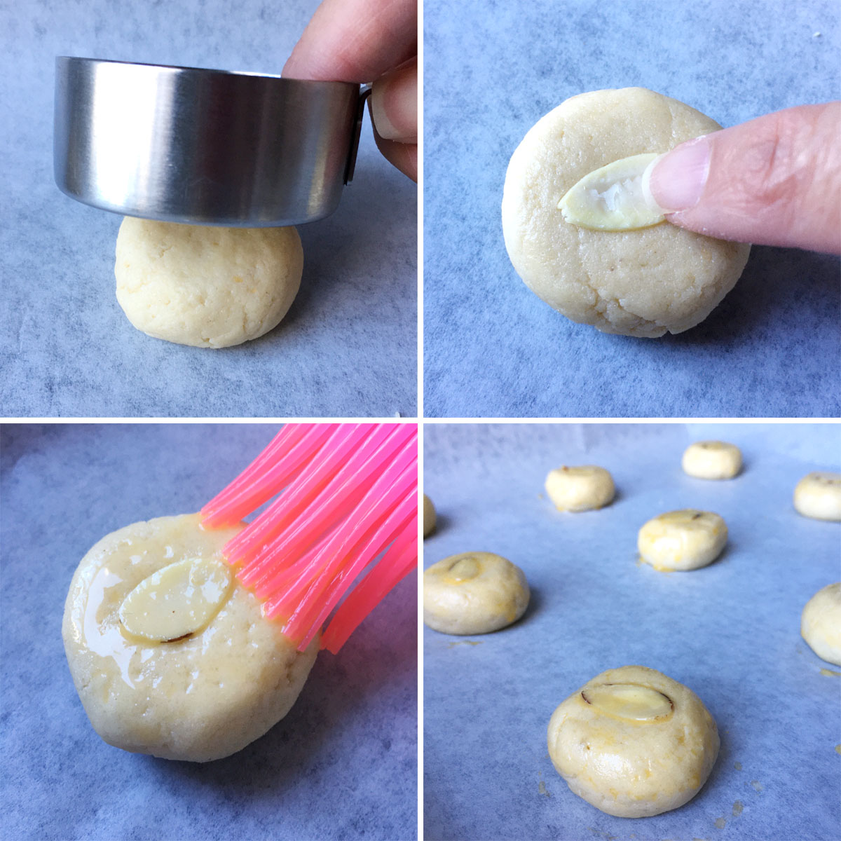 Flattening a round dough ball, placing a sliced almond on top, and brushing it with yellow egg wash.